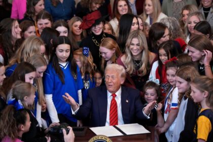 Donald Trump joined by women athletes signs the “No Men in Women’s Sports” executive order in the East Room at the White House on February 5, 2025